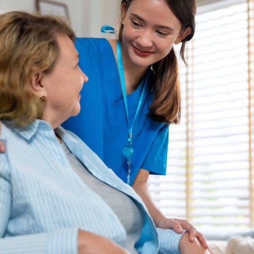 Qualified nurse providing care to a patient at home in a comfortable setting